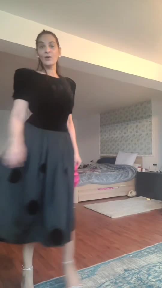 “Vintage Louis Féraud dress with a black velvet bodice and a flowing midi skirt featuring subtle polka-dot details. Elegant, feminine,